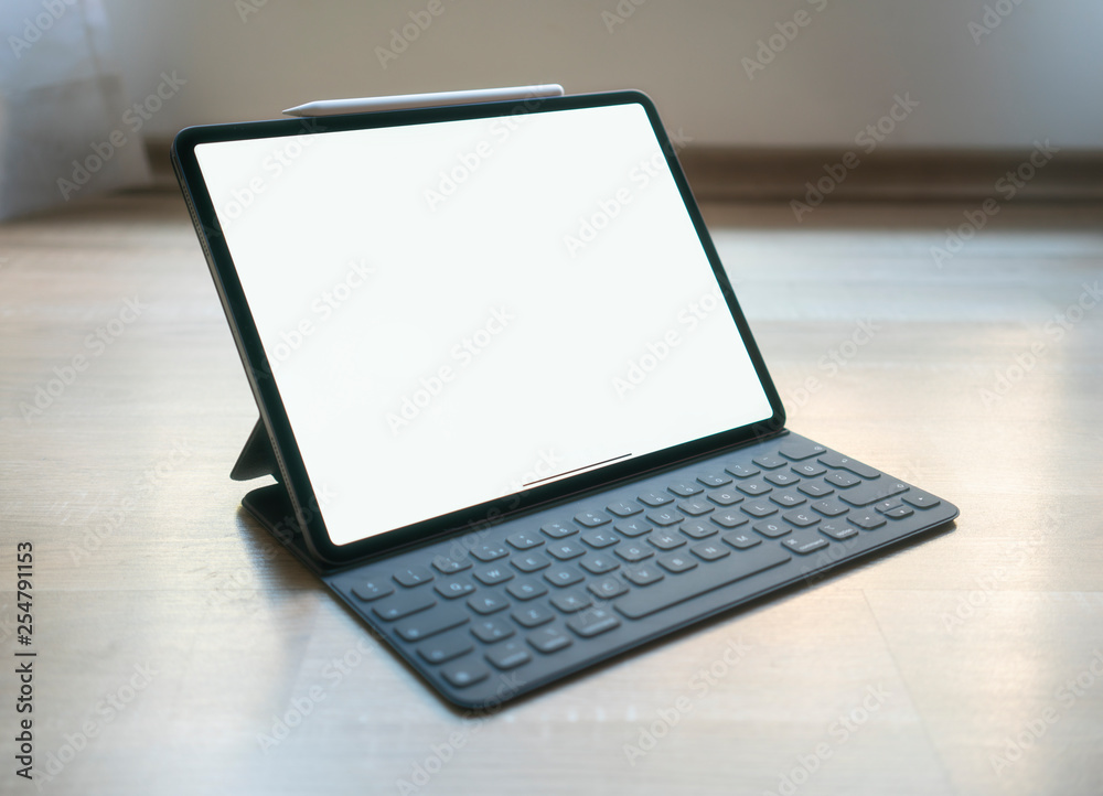  new pro tablet on the table with pencil and keyboard cover blank screen