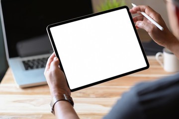 Wall Mural - Man holding and using blank screen tablet