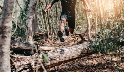 Wall Mural - Image of Athlete trail running, runner running on hill.