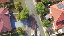Aerial Drone Shot Moving Along The Road Looking Straight Down On Suburban Street In Brisbane