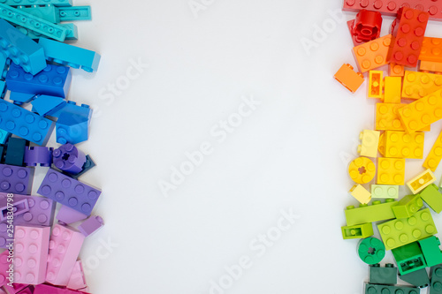 Multicolor Lego cubes on white background. Popular toys. Tableau sur Toile