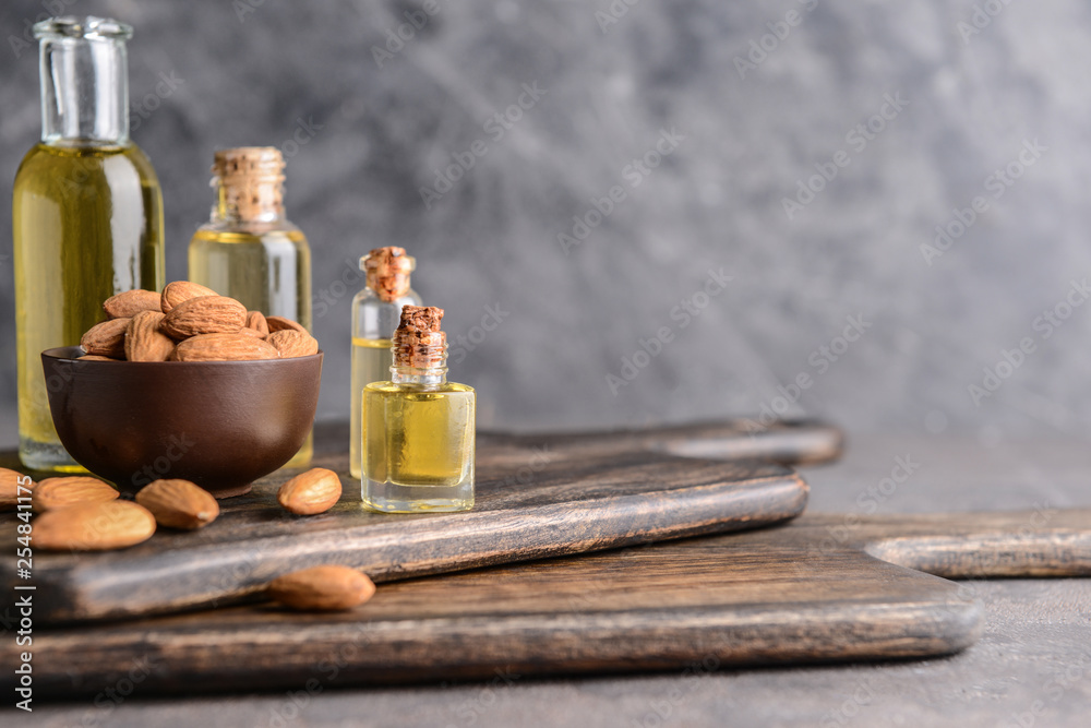 Composition with almond oil on table