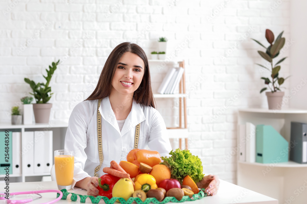 Portrait of female nutritionist in her office