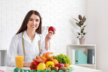 Wall Mural - Portrait of female nutritionist in her office