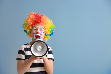 Sticker - Cute little boy with clown makeup and megaphone on color background. April fools' day celebration