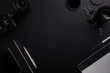 © Rostislav Sedlacek - Top view of the black table graphic designer with camera, lenses and diary with copy space. Flat lay shot