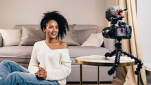 Smiling Woman Creating Video Content For Her Blog