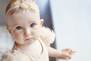 portrait of the lovely little girl with blue eyes. serious quiet look. copy space
