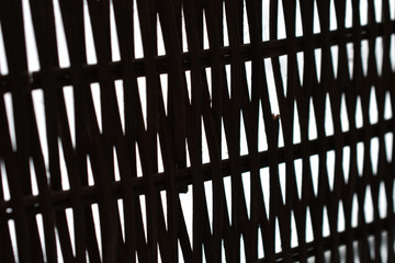 Poster - lattice of intertwined black rods on a white background in perspective