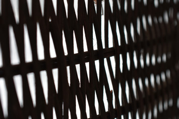 Poster - lattice of intertwined black rods on a white background in perspective