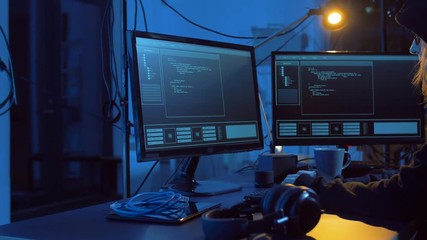 Poster - cybercrime, hacking and technology concept - female hacker in dark room creating code or using computer virus program for cyber attack