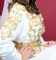 Wall Mural - Moroccan caftan in blue. Dressed by the Moroccan bride on her wedding day. Moroccan caftan is one of the most famous traditional clothing in the world