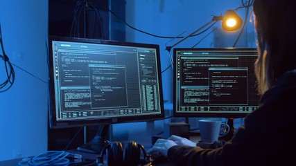 Poster - cybercrime, hacking and technology concept - female hacker in dark room creating code or using computer virus program for cyber attack