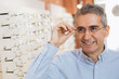 © cherryandbees - portrait of senior man wearing glasses in optic store