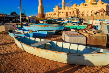 Old boats ashore near mosque El Mina Masjid in Hurghada, Egypt