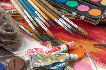 Paint brushes and paints for drawing.