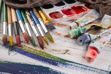 Paint brushes and paints for drawing.