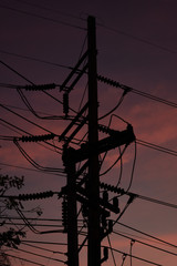 pylon electricity power line with sunset sky background