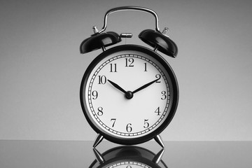 Alarm Clock on black and white background with selective focus and crop fragment. Business and Copy space concept