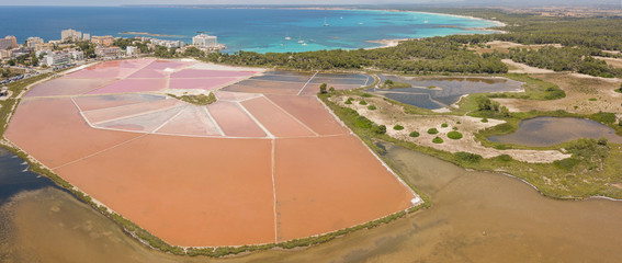 Wall Mural - Colonia Sant Jordi, Mallorca Spain. Amazing drone aerial landscape of the pink salt flats and the charming beach Estanys