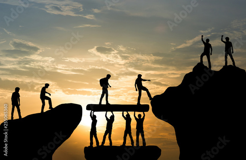 Fotomural Group of people on peak mountain climbing helping team work , travel trekking su
