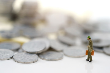 Wall Mural - Miniature people:  Businessmen standing with coins stack, Finance, investment and growth in business concept.