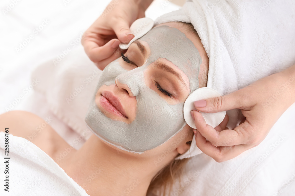 Young woman undergoing treatment in beauty salon