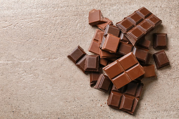 Wall Mural - Sweet tasty chocolate on light background