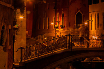 Long exposure. View of the bridge over canal in Venice, Italy, at night.