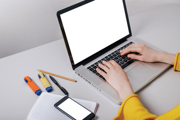 mockup image cell phone,computer hand typing with blank screen for text, girl using laptop and searching information
