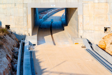 Underpass and tunnel for the construction of a new railway line. Detail of sewage and metal lattice ducts for the electrification of the railway line.