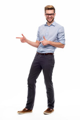 Wall Mural - full length portrait of young man pointing
