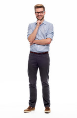 Wall Mural - full length portrait of young man standing on white background