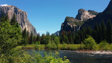Yosemite National Park. Yosemite Valley View Vista Point. Merced River On Foreground, El Capitan On The Left And Bridaveil Falls On Right On Background.