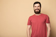 © lashkhidzetim - Young bearded man laughing, studio shot.