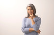 © Svyatoslav Lypynskyy - Asian woman smiling and pointing her finger to her cheek