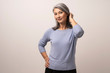 © Svyatoslav Lypynskyy - Smiling Asian woman touches her grey hair