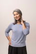 © Svyatoslav Lypynskyy - Smiling Asian woman touches her grey hair