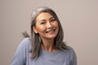 © Svyatoslav Lypynskyy - Charming Asian mature woman smiles at camera
