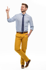 Wall Mural - full length portrait of young man pointing