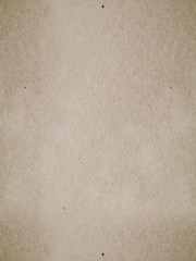 Brown Kraft surface, seamless texture. Dark beige textured cardboard binding background, old vintage paper pattern