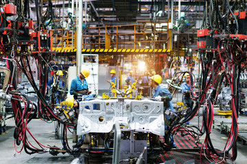 Wall Mural - Welding robots movement in a car factory