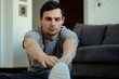 © sipcrew - A man doing exercises at home. Healthy lifestyle concept.