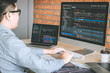 © Ngampol - Professional Developer programmer working a software website design and coding technology, writing codes and database in company office, Global cyber connection technology