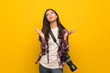 © luismolinero - Photographer teenager girl over yellow wall frustrated by a bad situation