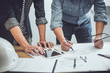 © Freedomz - Engineer Teamwork Meeting, Drawing working on blueprint meeting for project working with partner on model building and engineering tools in working site, Construction and structure concept