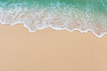 Soft wave of sea on empty sandy beach Background with copy space