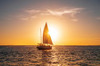 © Yuri-U - Sailing yacht in the ocean at sunset