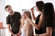 © Africa Studio - Professional hairdresser and trainees working with client in salon. Apprenticeship concept