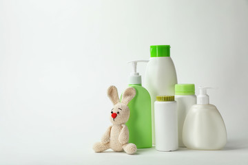 Wall Mural - baby cosmetic products and toy on white background